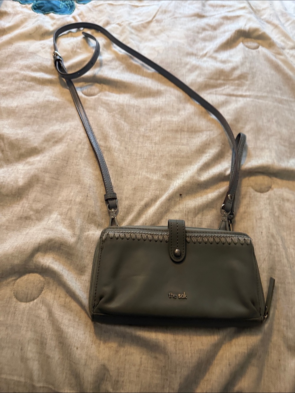 The Sak olive green crossbody bag with stitched trim